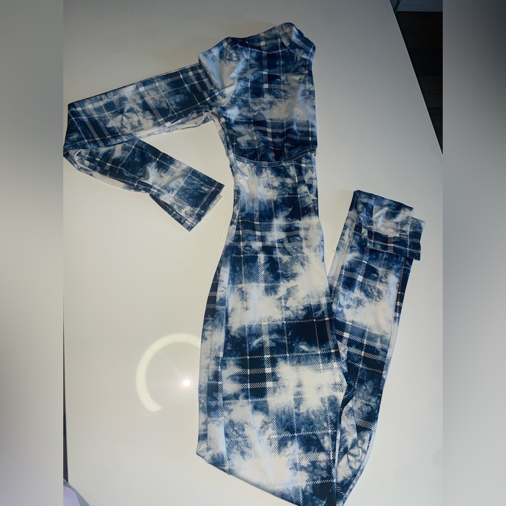 Jumpsuit very stretchy material fits super good. white & blue